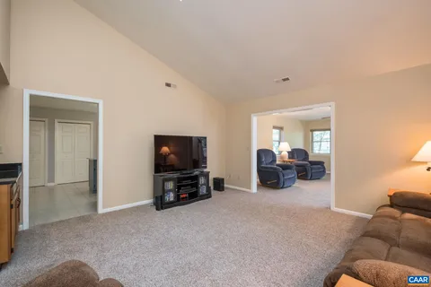 a view of a livingroom with furniture and a flat screen tv