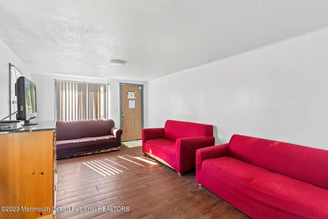 a bedroom with two beds and a couch