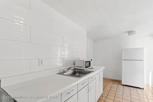 a view of a bedroom with a bed