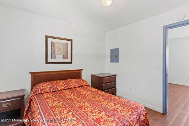 a bathroom with a granite countertop sink toilet a mirror and bathtub