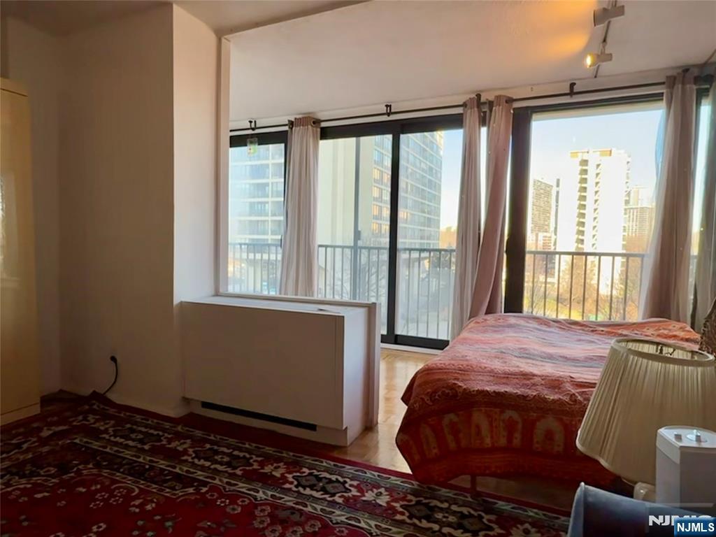 5 Horizon Road, Unit 307 Fort Lee, NJ 07024 - Photo 21 of 31 a bedroom with a bed and a window