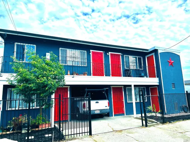 a front view of building with retail shops