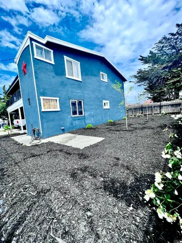 a kitchen with a stove a refrigerator and a sink