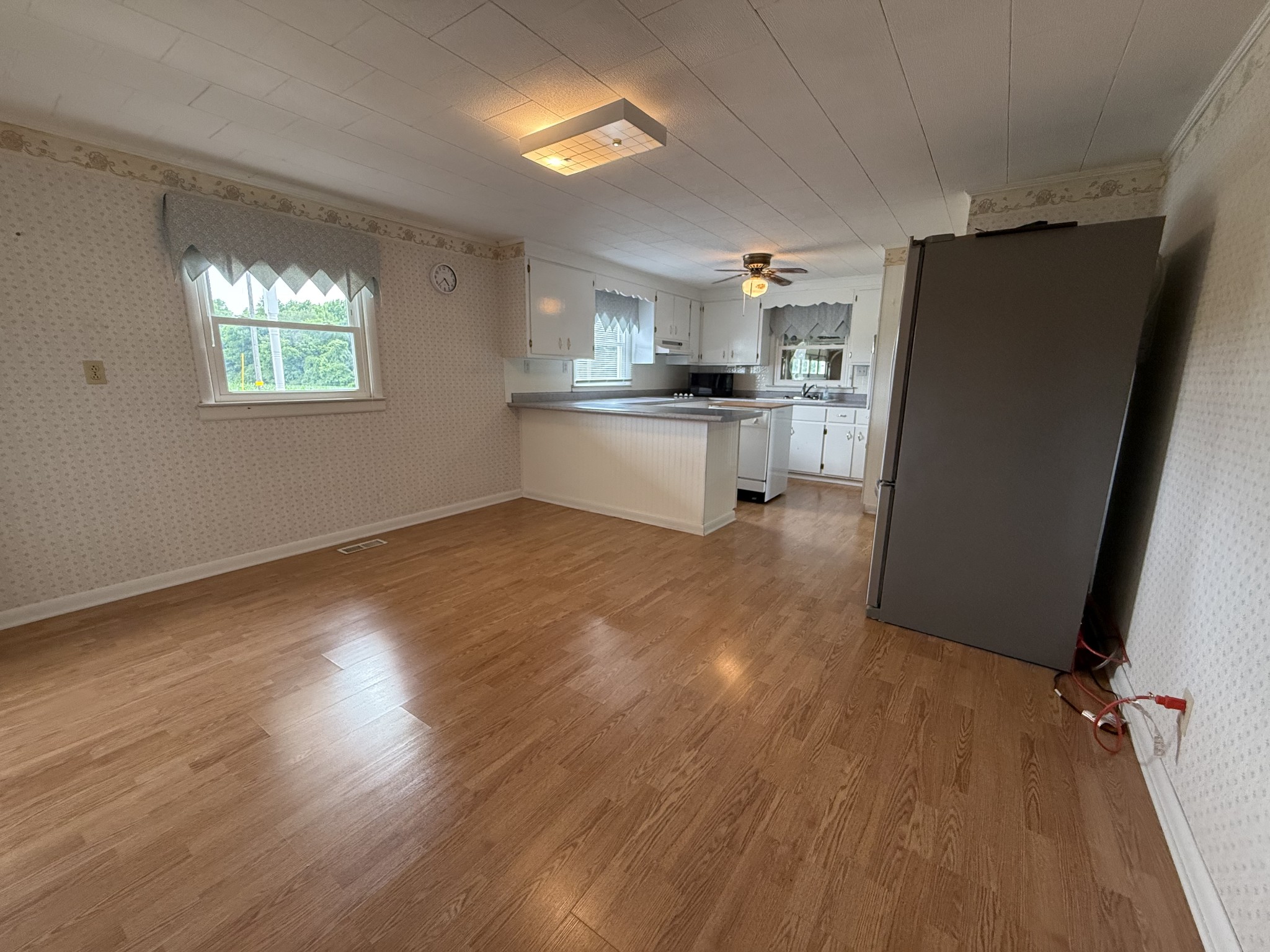 2971 Monroe Floyd Road Decherd, TN 37324 - Photo 6 of 26 an empty room with wooden floor and windows