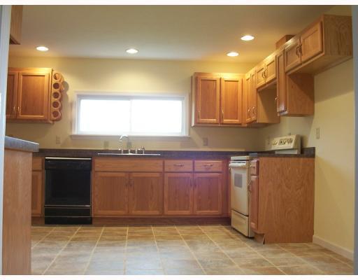 891 Rutledge Road Transfer, PA 16154 - Photo 6 of 15 Kitchen. New oak kit. with recess lighting and tile floor.