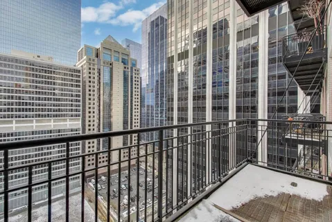 a view of a balcony with a potted plant