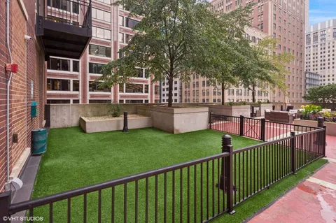 a front view of a building with outdoor seating