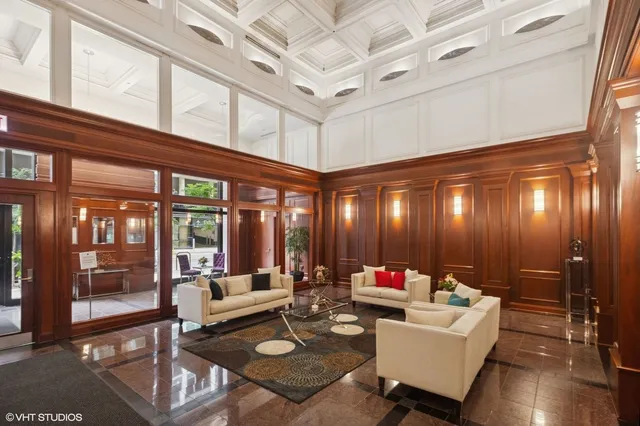 a lobby with furniture and stairs