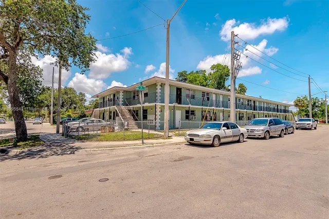 a view of a street with cars
