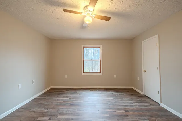 a view of a dry yard with mountains
