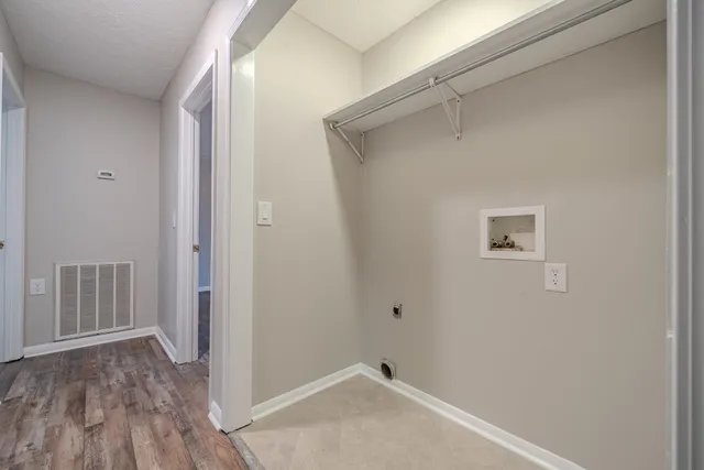 a white toilet and shower curtain