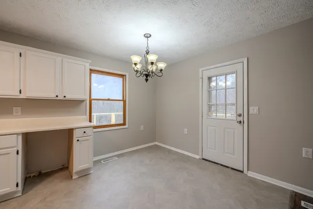 a spacious bathroom with a sink and a mirror