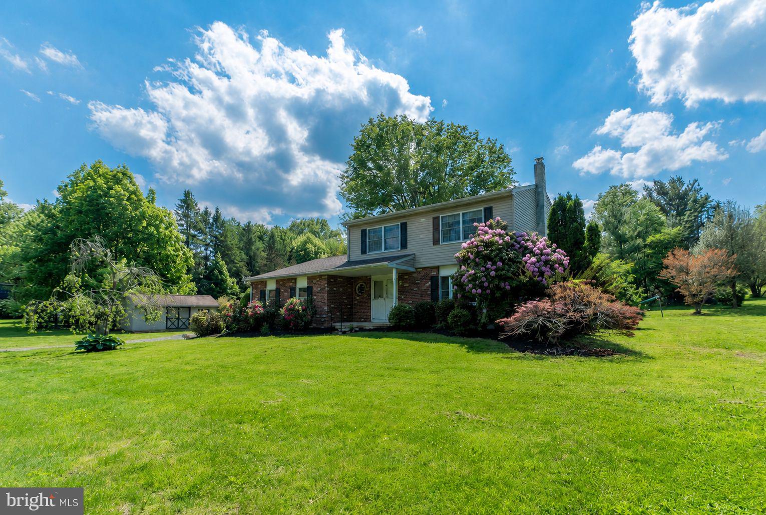 223 Trythall Road Elverson, PA 19520 - Photo 5 of 78 a view of a house with a big yard and potted plants