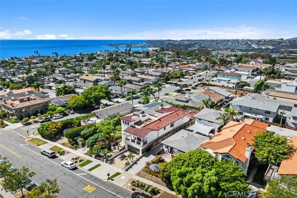 an aerial view of residential building and ocean