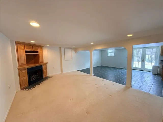 a view of a kitchen with a sink and a fireplace