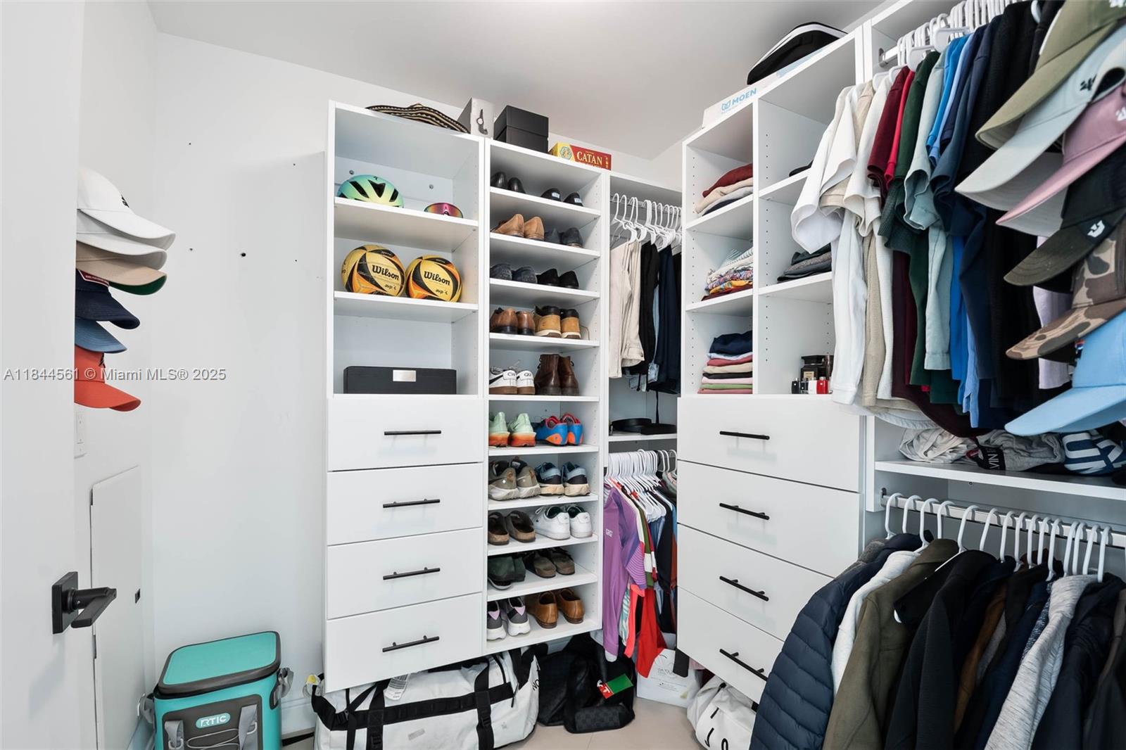 3301 Northeast 1st Avenue, Unit H1211 Miami, FL 33137 - Photo 12 of 37 a view of walk in closet with clothes and shoes
