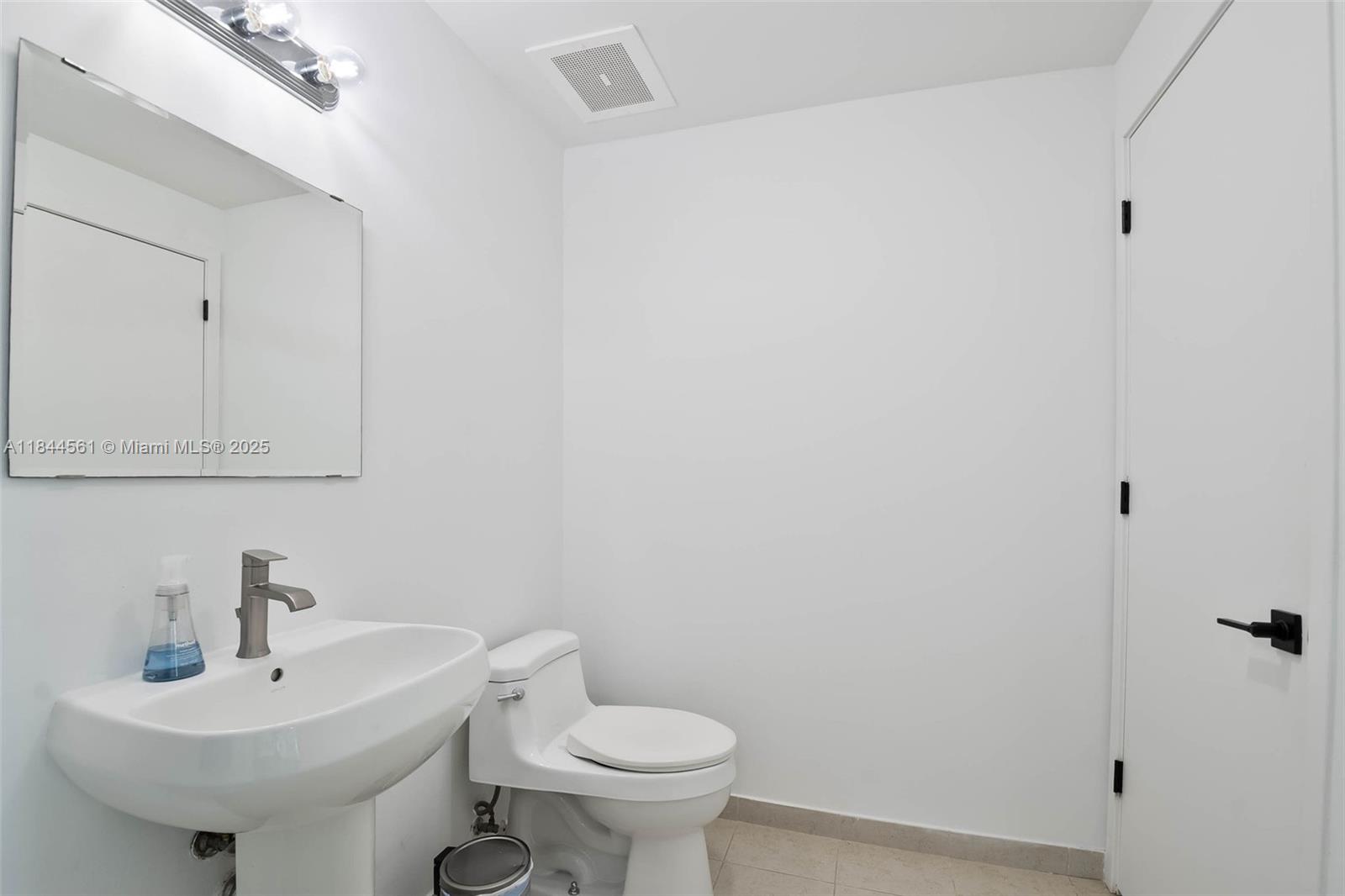 3301 Northeast 1st Avenue, Unit H1211 Miami, FL 33137 - Photo 14 of 37 a bathroom with a sink a toilet and mirror