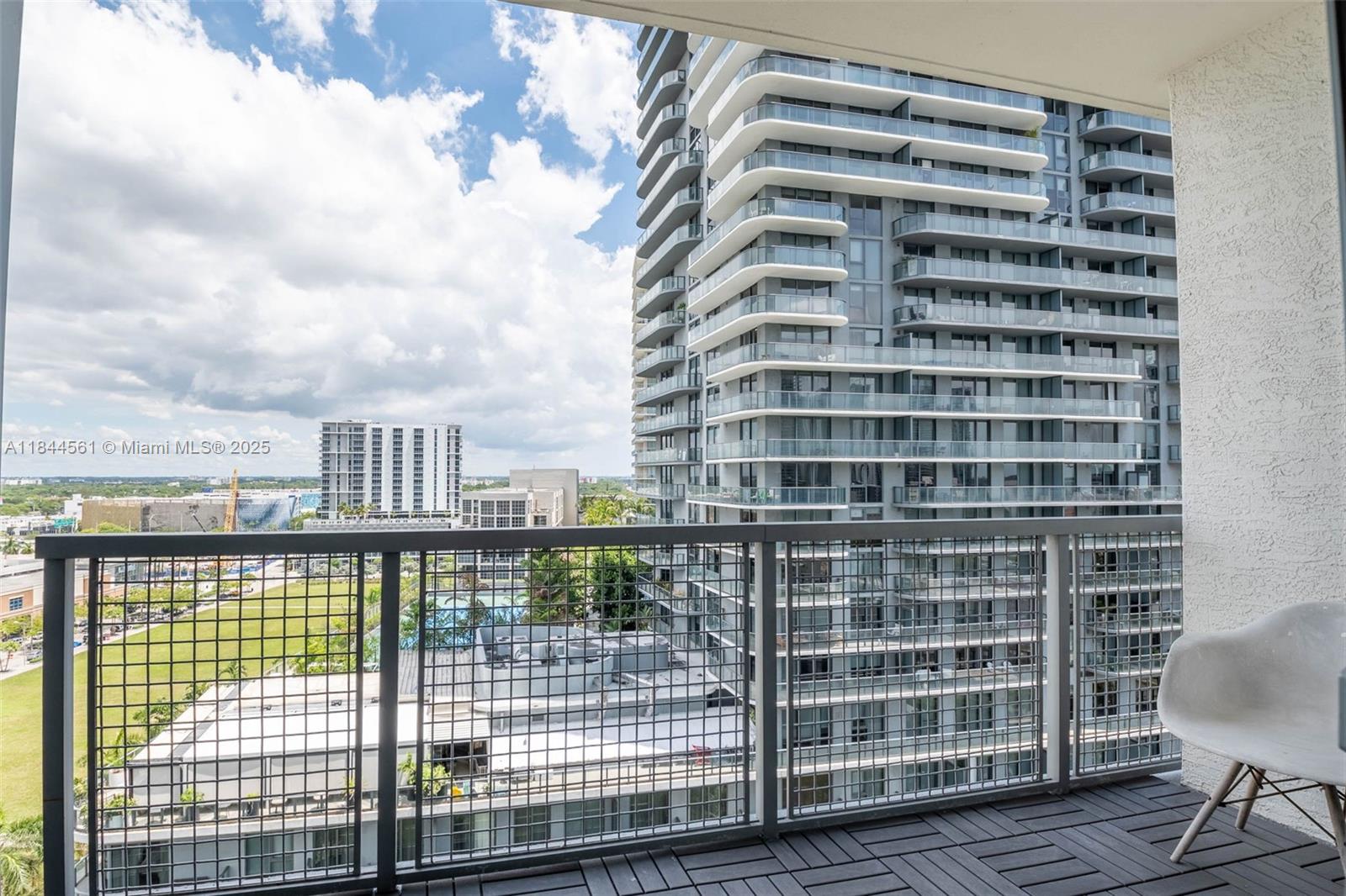 3301 Northeast 1st Avenue, Unit H1211 Miami, FL 33137 - Photo 16 of 37 a view of a balcony with a floor to ceiling window wooden floor