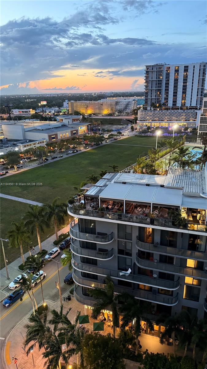 3301 Northeast 1st Avenue, Unit H1211 Miami, FL 33137 - Photo 24 of 37 a view of a swimming pool with a table and chairs in a patio