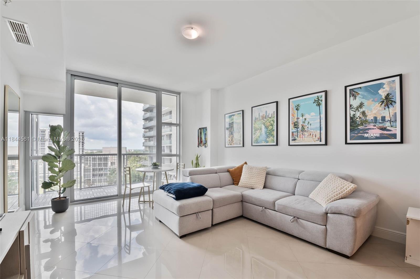 3301 Northeast 1st Avenue, Unit H1211 Miami, FL 33137 - Photo 6 of 37 a living room with furniture and a large window with balcony view