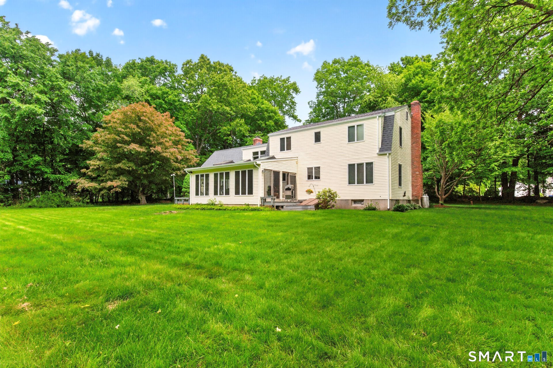 5 Shingle Mill Drive Canton, CT 06019 - Photo 36 of 38 a view of a white house with a big yard