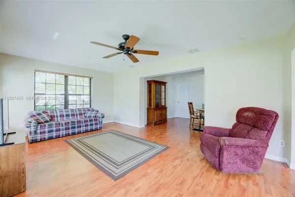 a living room with furniture rug and window