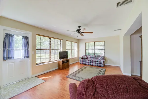 a living room with furniture and a window