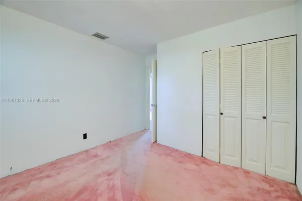 a view of a room with an empty space