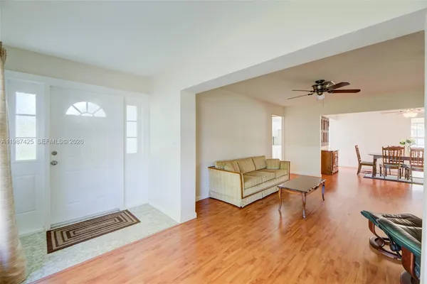 a bedroom with furniture and a wooden floor