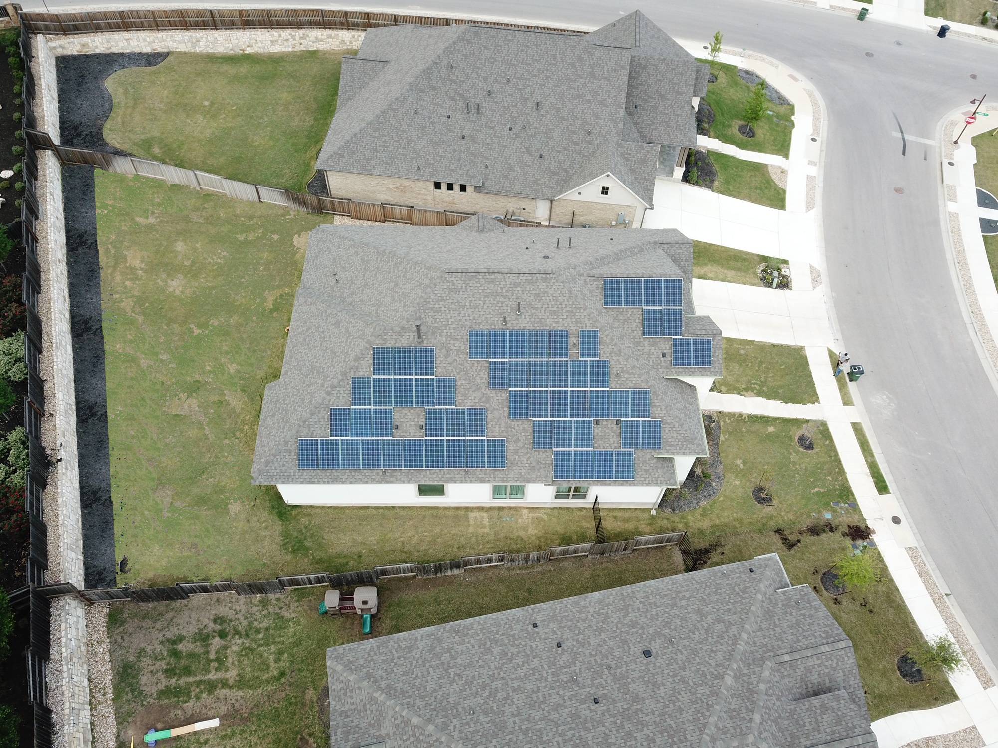 104 Catani Loop Georgetown, TX 78628 - Photo 33 of 34 An aerial perspective showcases the solar-equipped roof of a contemporary home, ready for sustainable living.