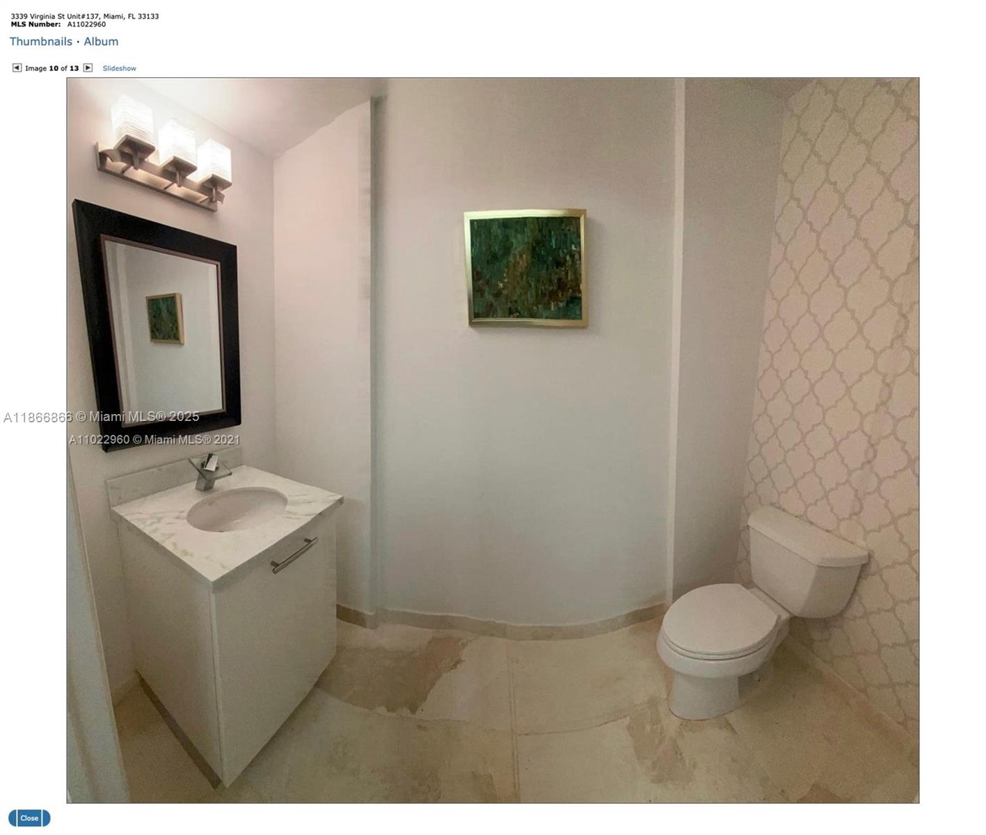 3339 Virginia Street, Unit 137 Miami, FL 33133 - Photo 11 of 11 a bathroom with a toilet sink and mirror