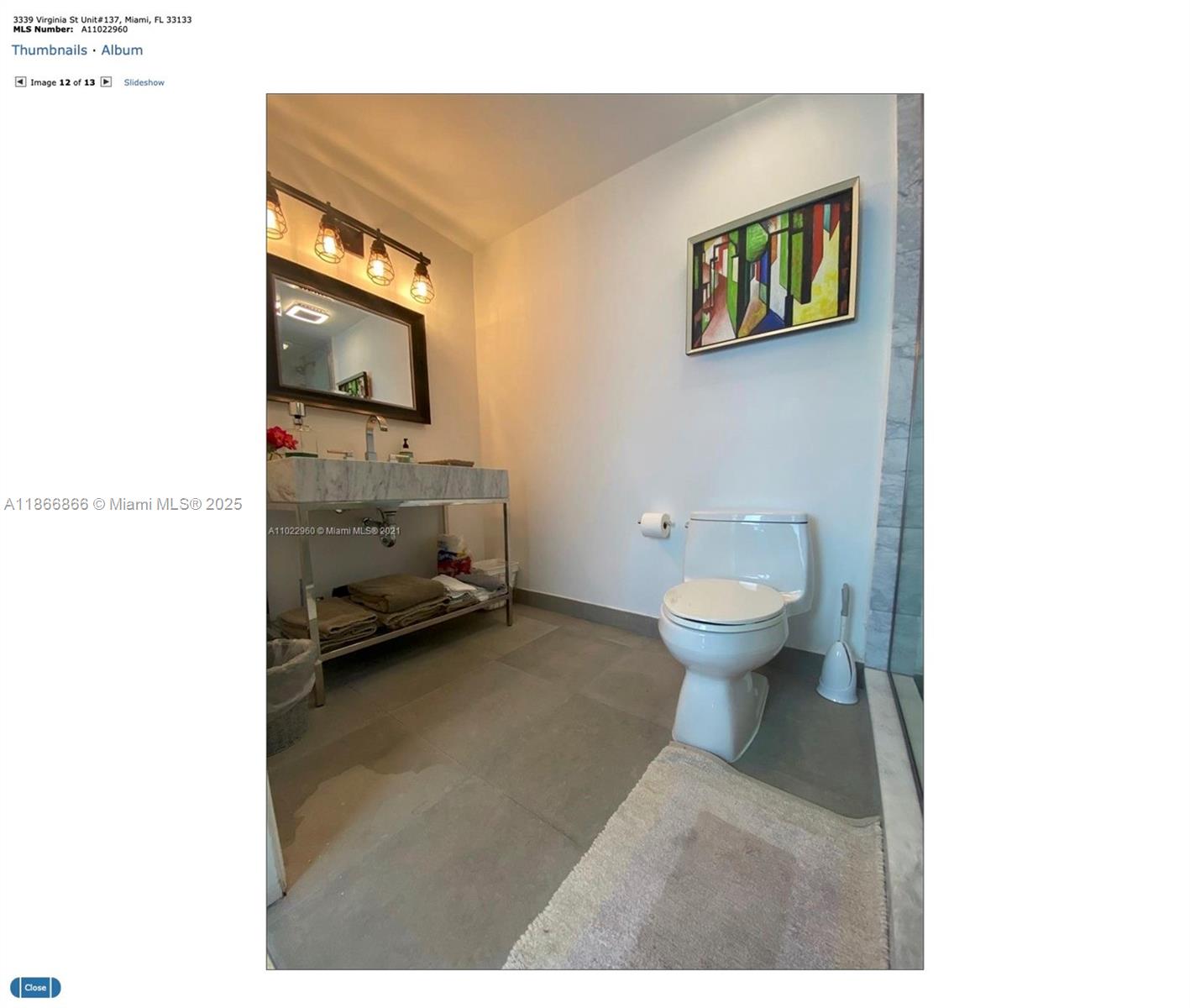 3339 Virginia Street, Unit 137 Miami, FL 33133 - Photo 5 of 11 a view of a bathroom with a sink and a toilet