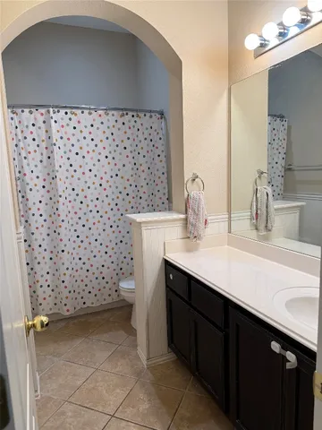 a bathroom with a sink a vanity and a mirror