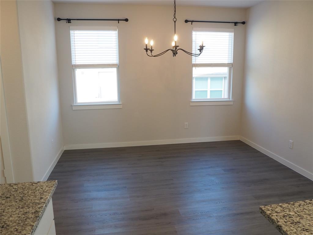 2502 Sun Grove Road Melissa, TX 75454 - Photo 12 of 40 wooden floor in an empty room with a window