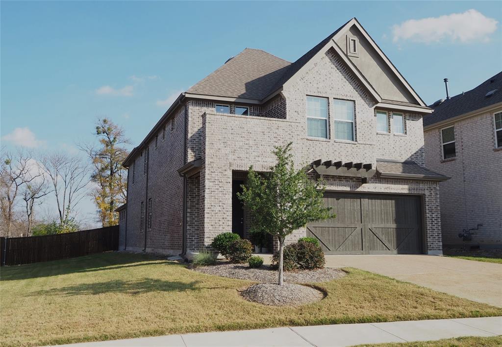 2502 Sun Grove Road Melissa, TX 75454 - Photo 2 of 40 a front view of a house with garden