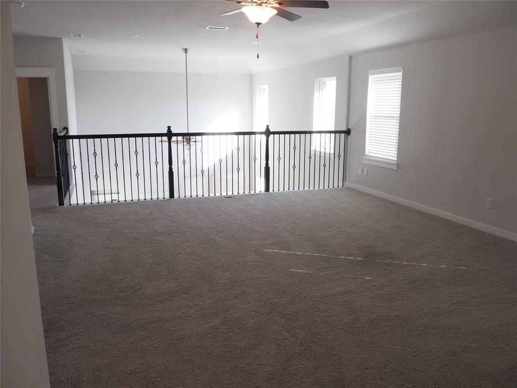 2502 Sun Grove Road Melissa, TX 75454 - Photo 22 of 40 a view of a hallway with a chandelier fan