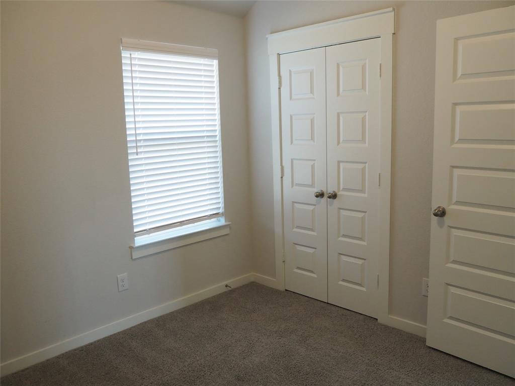 2502 Sun Grove Road Melissa, TX 75454 - Photo 28 of 40 an empty room with windows