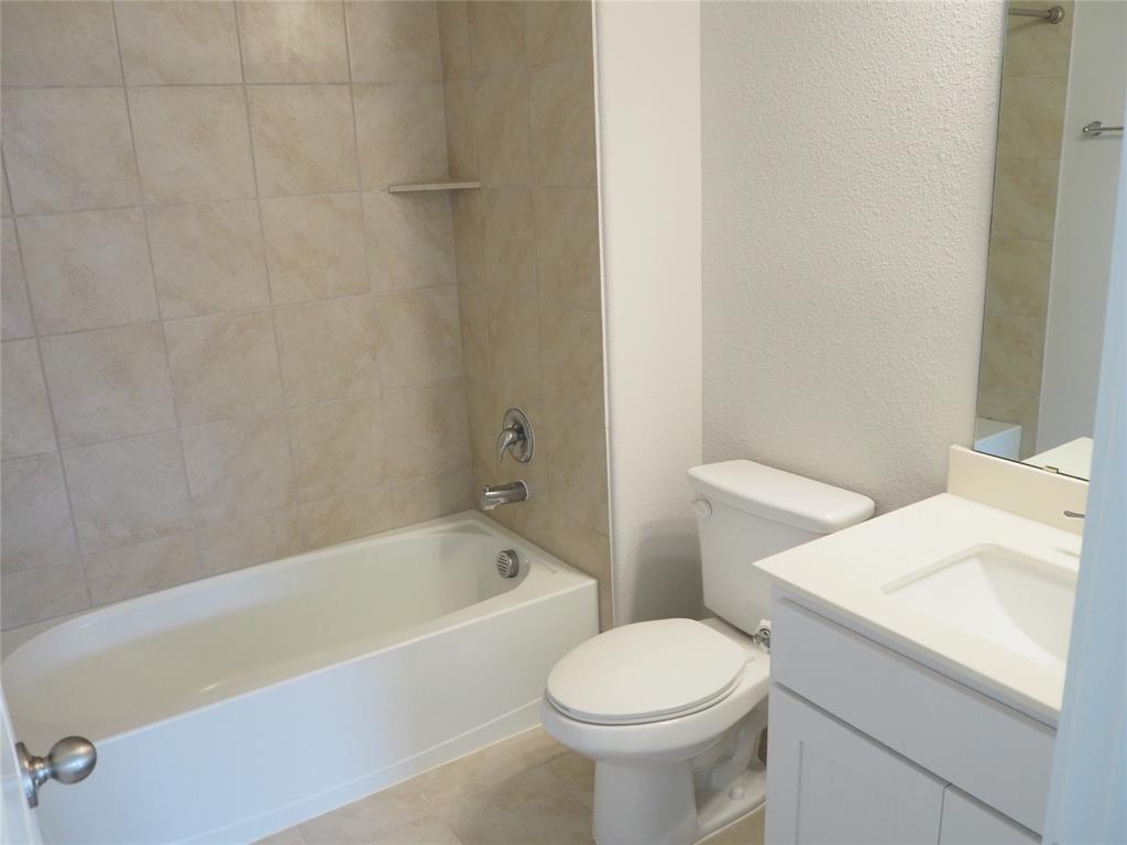 2502 Sun Grove Road Melissa, TX 75454 - Photo 30 of 40 a white bath tub sitting next to a white toilet
