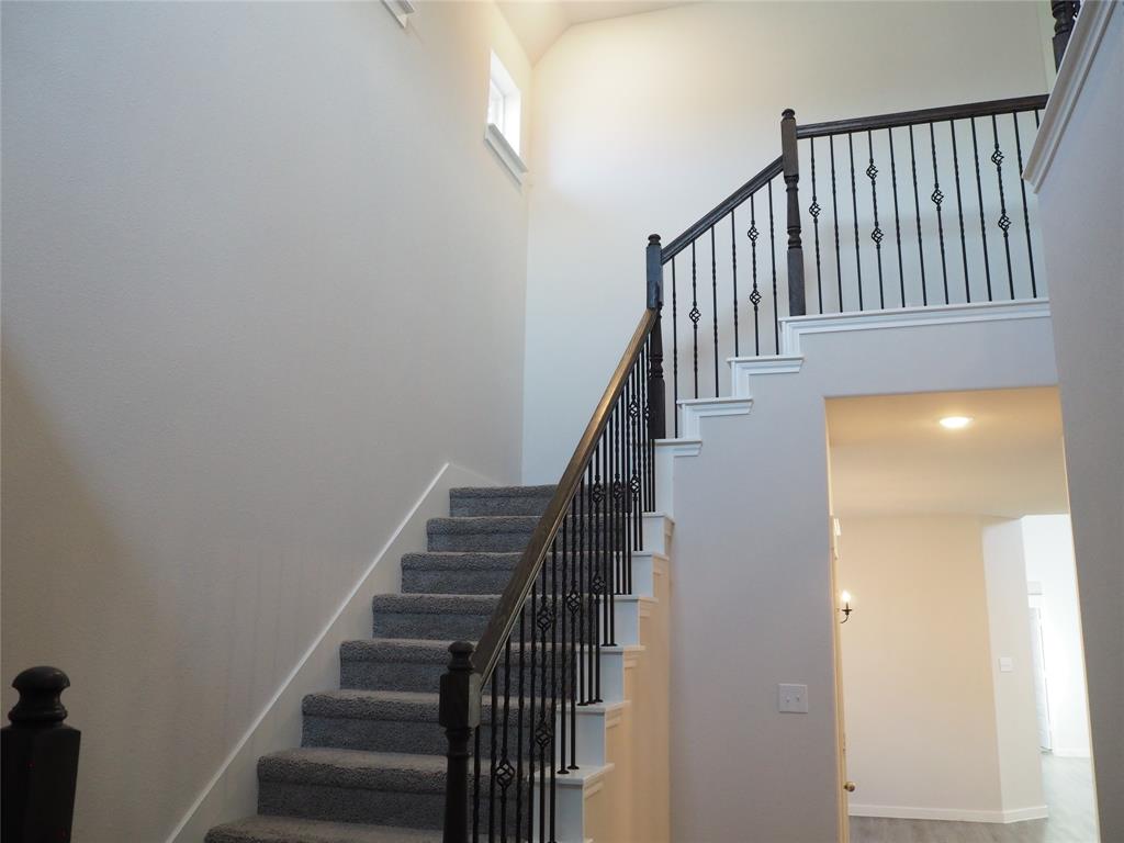 2502 Sun Grove Road Melissa, TX 75454 - Photo 4 of 40 a view of staircase with railing and white walls