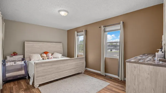 a bed room with a bed and a window