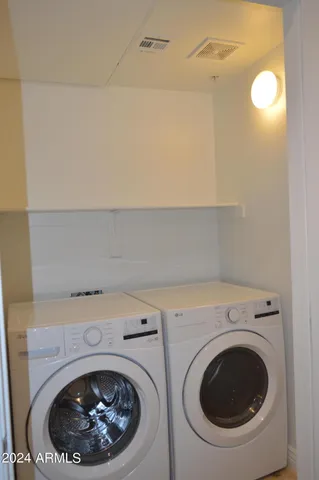 a bathroom with a shower curtain and a toilet