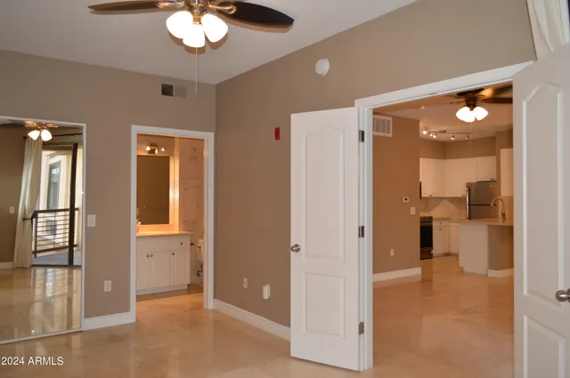 a view of a chandelier fan and shower in a room