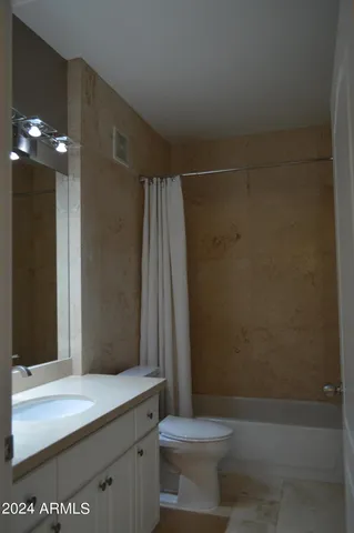 an empty room with a empty space and a window