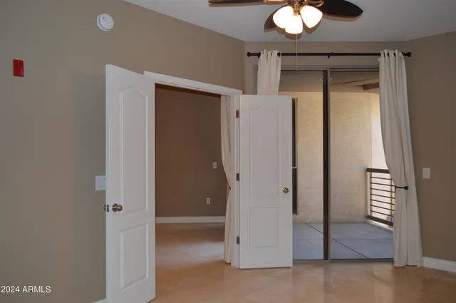 a view of an empty room with a window