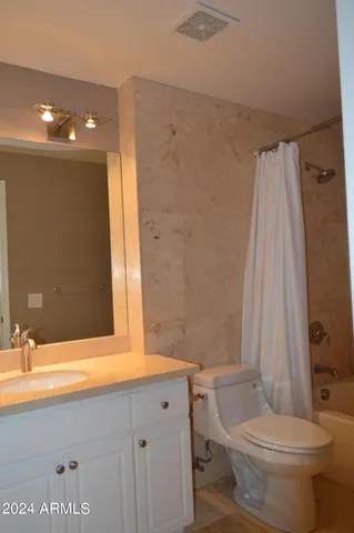 a bathroom with a shower and a bath tub