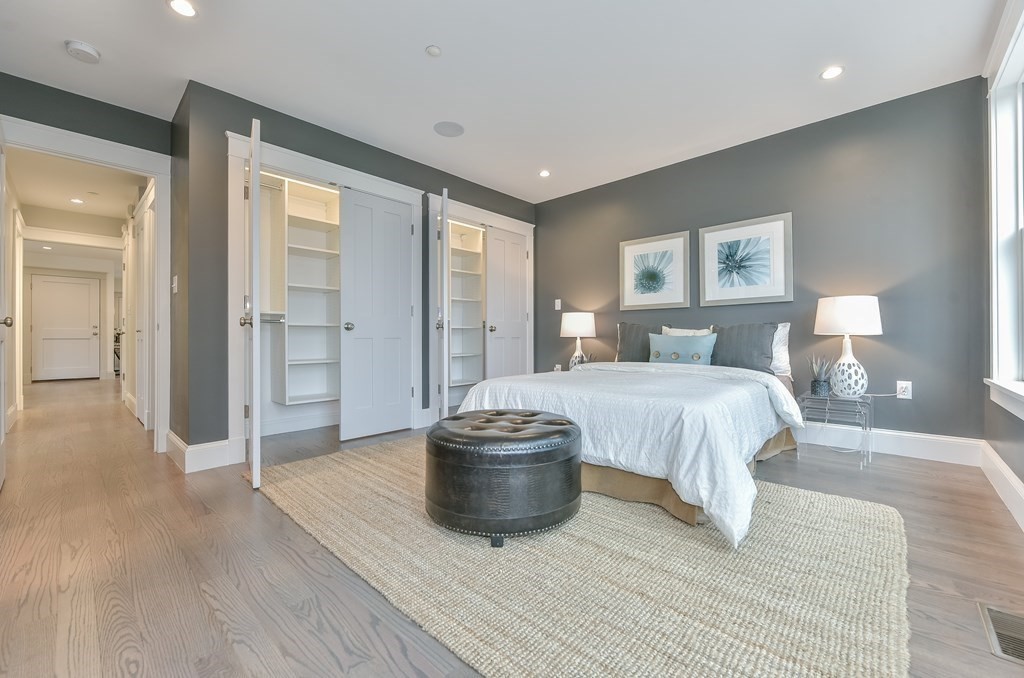 34 Rossmore Road, Unit ONE Boston, MA 02130 - Photo 17 of 21 a spacious bedroom with a bed and a table