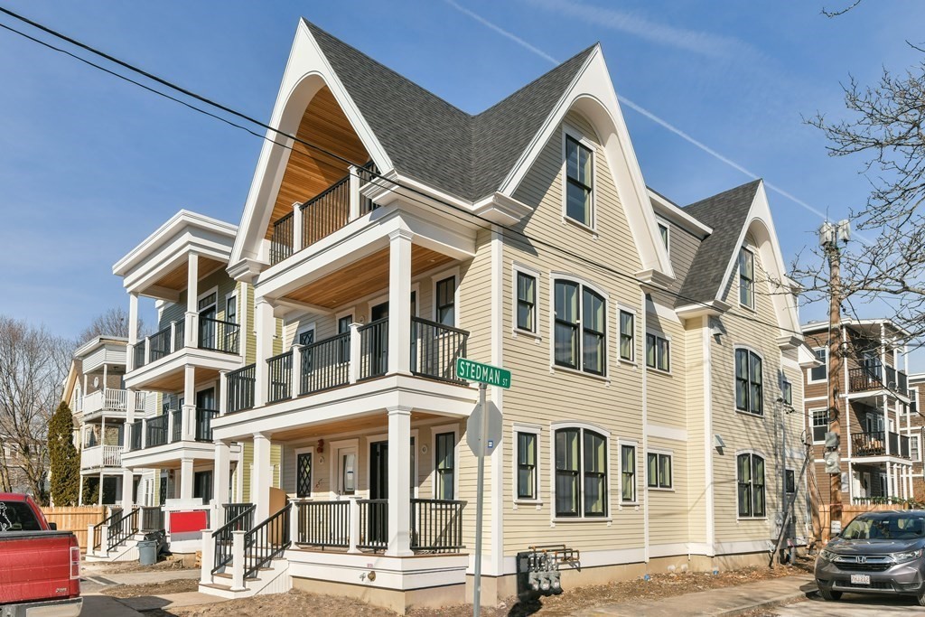 34 Rossmore Road, Unit ONE Boston, MA 02130 - Photo 2 of 21 a view of a white building among the street