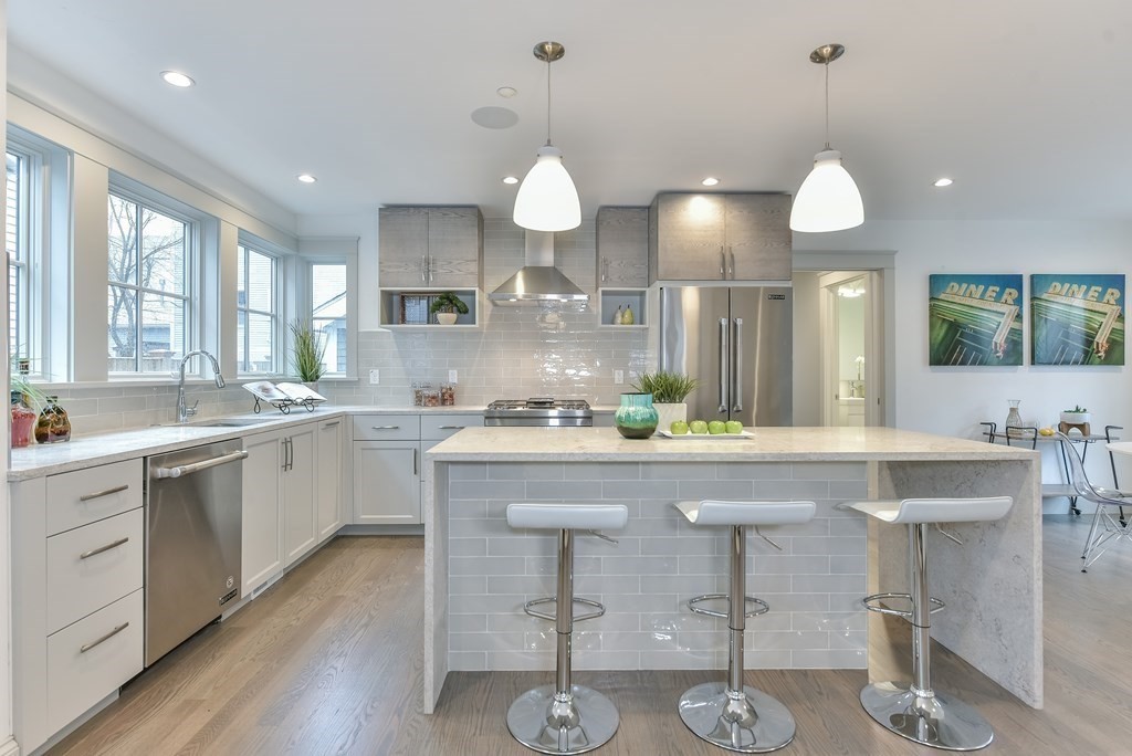 34 Rossmore Road, Unit ONE Boston, MA 02130 - Photo 6 of 21 a large kitchen with a large island in it