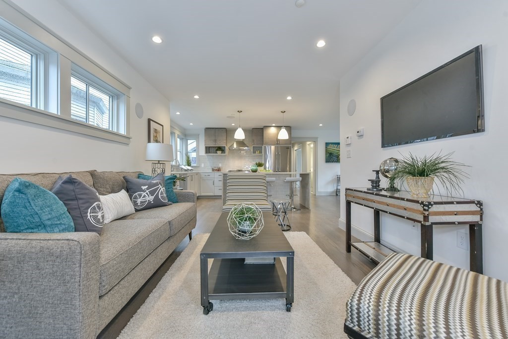 34 Rossmore Road, Unit ONE Boston, MA 02130 - Photo 8 of 21 a living room with furniture and a flat screen tv