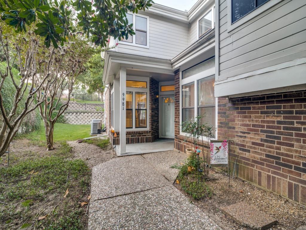 9981 Waterfront Trail Rowlett, TX 75087 - Photo 1 of 26 a view of a house with backyard and garden